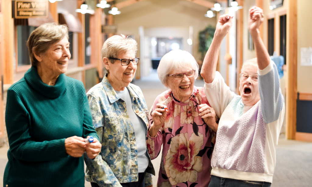 4 senior females celebrating