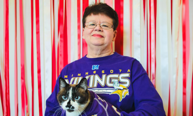 Senior living resident holding her cat