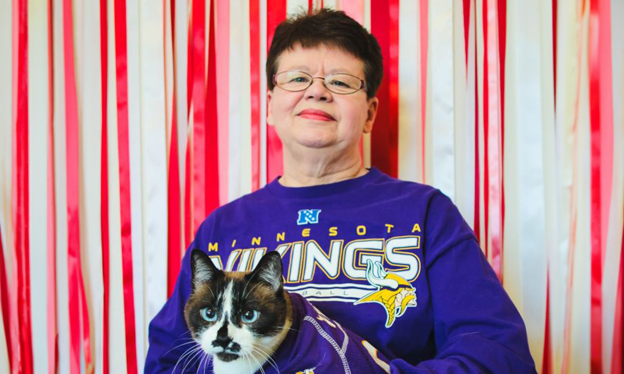 Senior living resident holding her cat