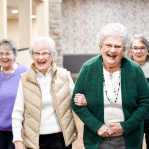 Senior ladies walking arm in arm as a group