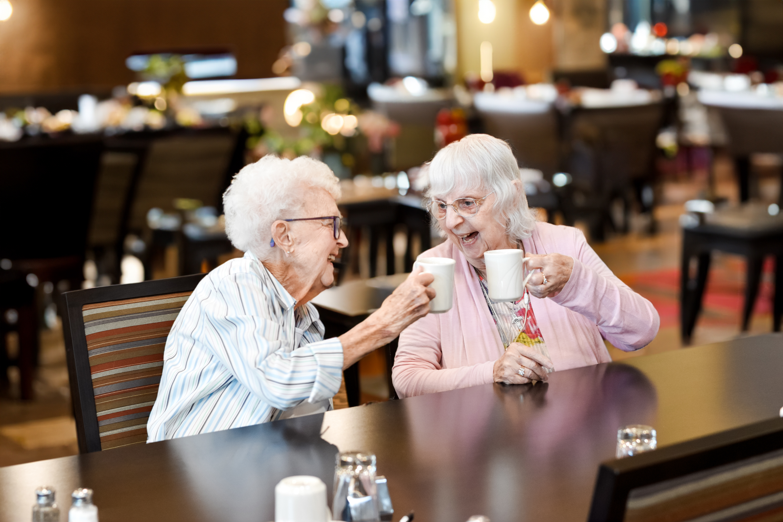 Female residents with coffee cups in hand