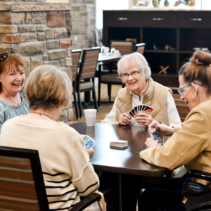 Senior women playing cards