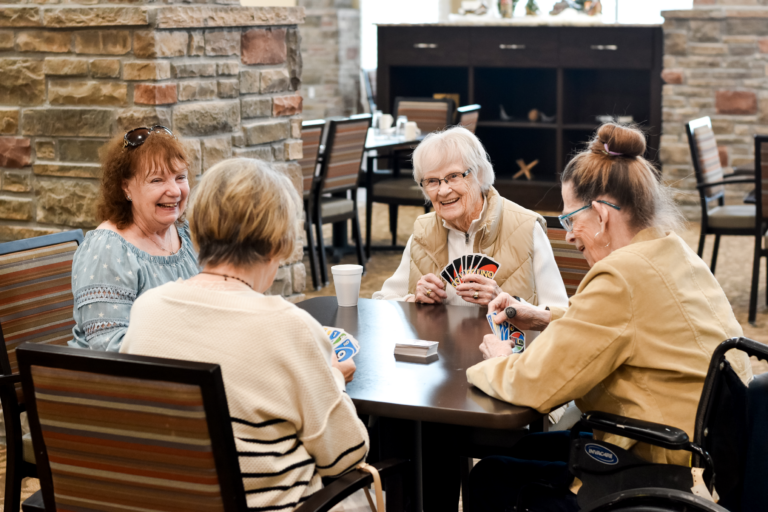 Senior women playing cards