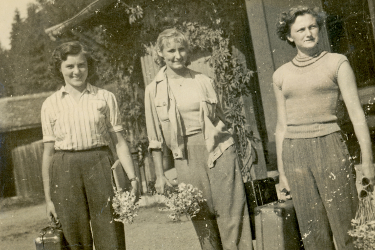 black and white image of females holding boquets of flowers