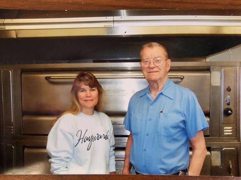 Ray Peloquin and his daughter, Amy standing in the Kitchen at Dave's Pizza